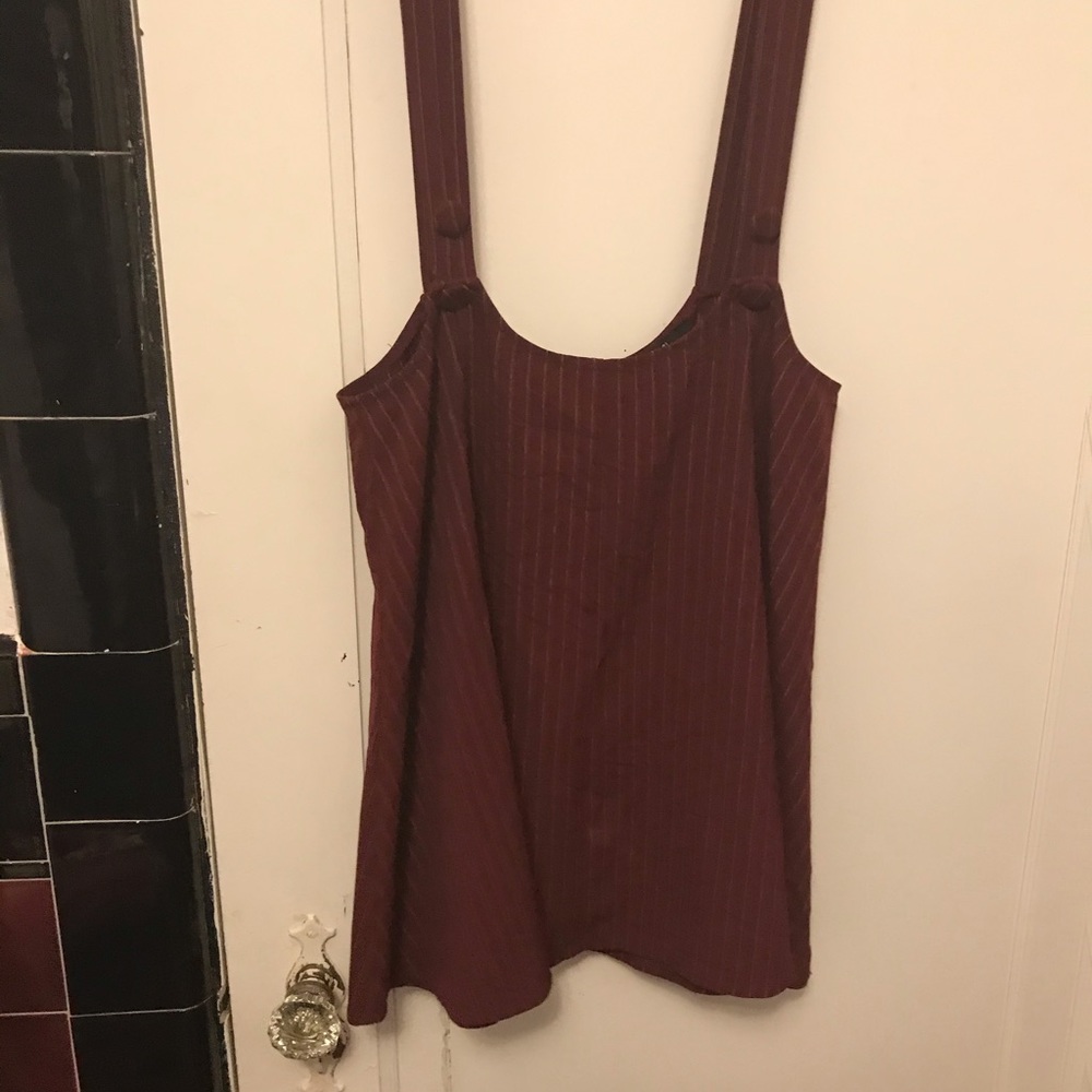 A red suspender skirt